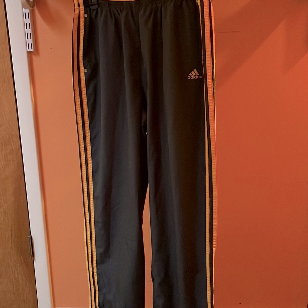 Adidas Black Joggers with Vibrant Orange Accents